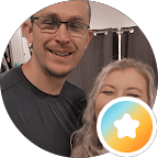 Smiling man with glasses and blonde woman in a circular frame with a star overlay.